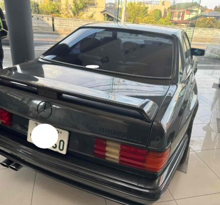 The Widebody's back end, commanding deference from traffic behind.