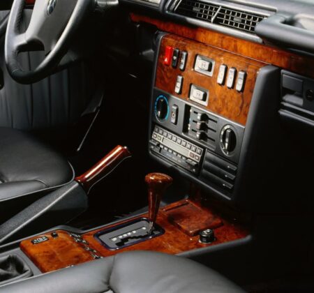 The Pinnacle of the ’90s: A Sanctuary of Walnut and Leather.